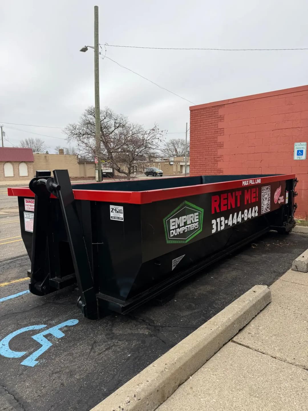 20 Yard roll-off dumpster with green rails, Empire Dumpsters