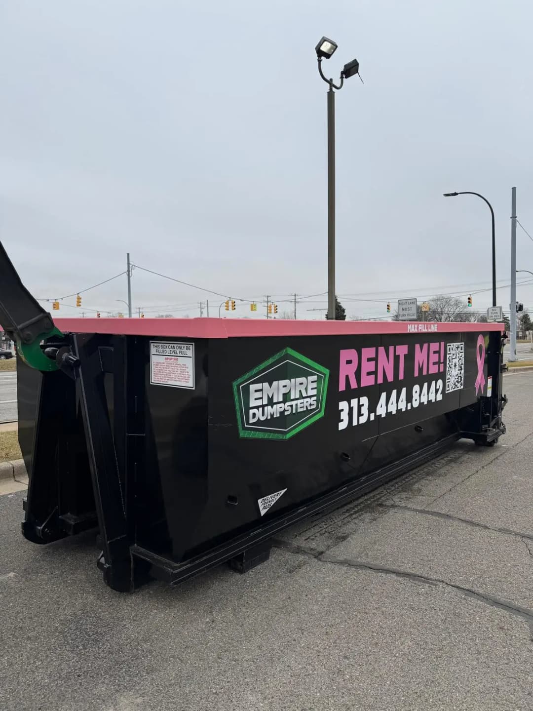 15 Yard roll-off dumpster with green rails, Empire Dumpsters